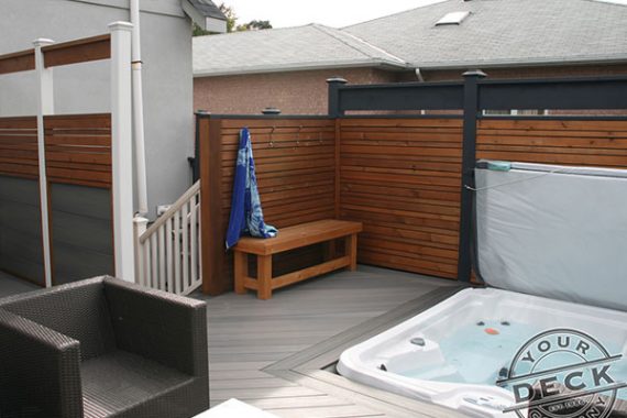 Fiberon deck with built in hot tub and cedar privacy walls