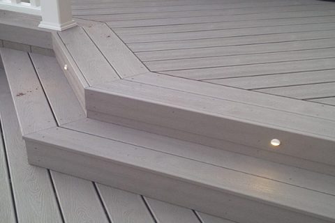 Image of a Trex deck constructed using Trex Gravel Path decking accented with a few deck lights in the stairs