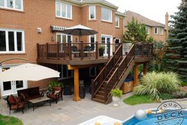 Deck builder in Thornhill. Fully landscaped backyard with an elevated Trex deck, stone patio, pool and a hot tub.