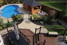 Deck builder in Newmarket. Backyard landscaping and a Trex deck overlooking the pool